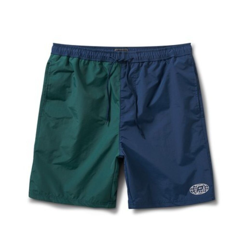 A pair of color-blocked shorts, split between dark green and navy blue, with a white logo on the lower right leg.