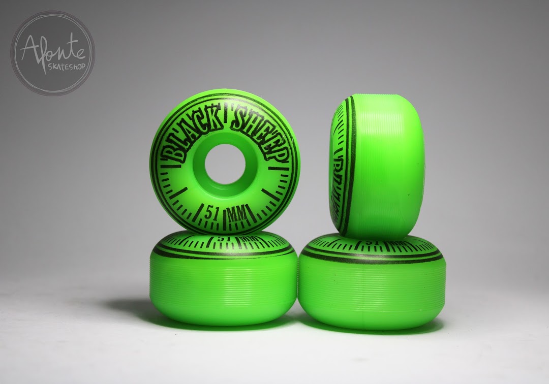 A stack of four bright green skateboard wheels with black branding and measurements.