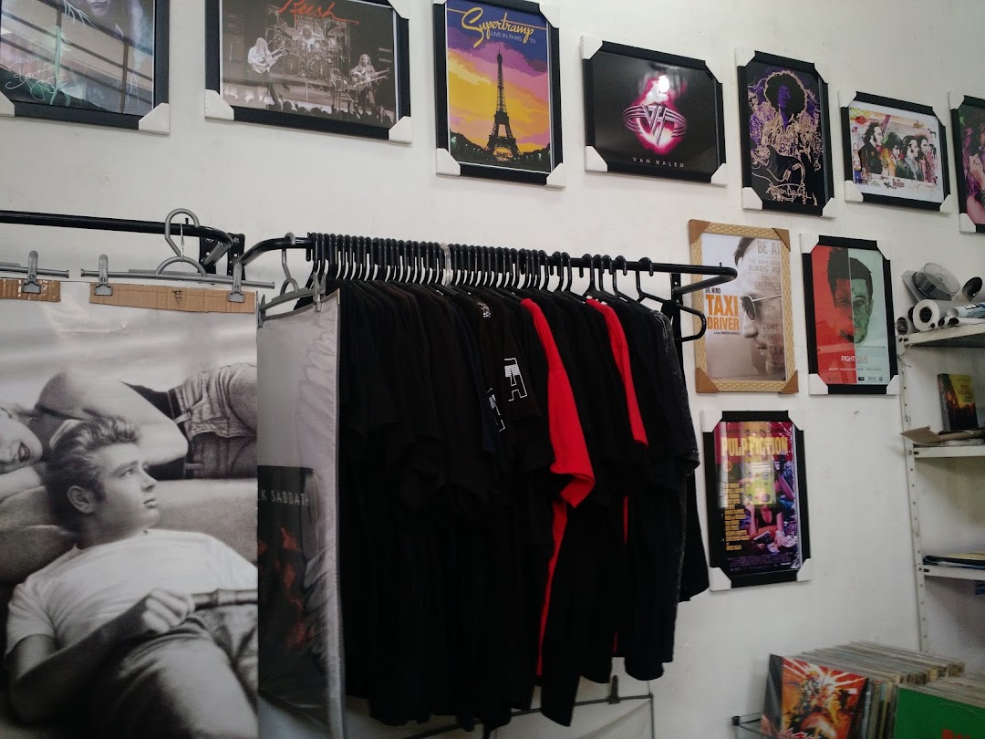 Aqualung Records shop interior with band posters, t-shirts, and vinyl records displayed.