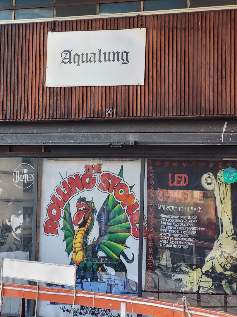 Aqualung Records shop front with posters of The Beatles, The Rolling Stones, and Led Zeppelin.