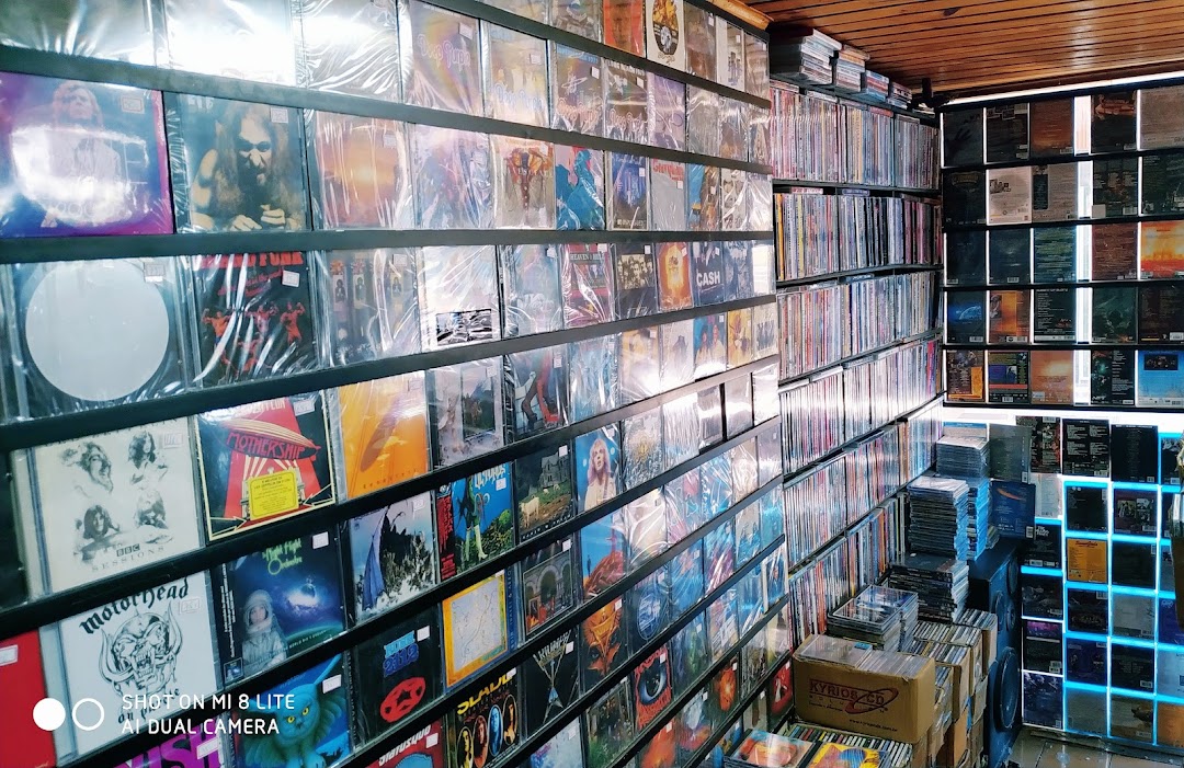 Aqualung Records shop interior filled with shelves of vinyl records and CDs.