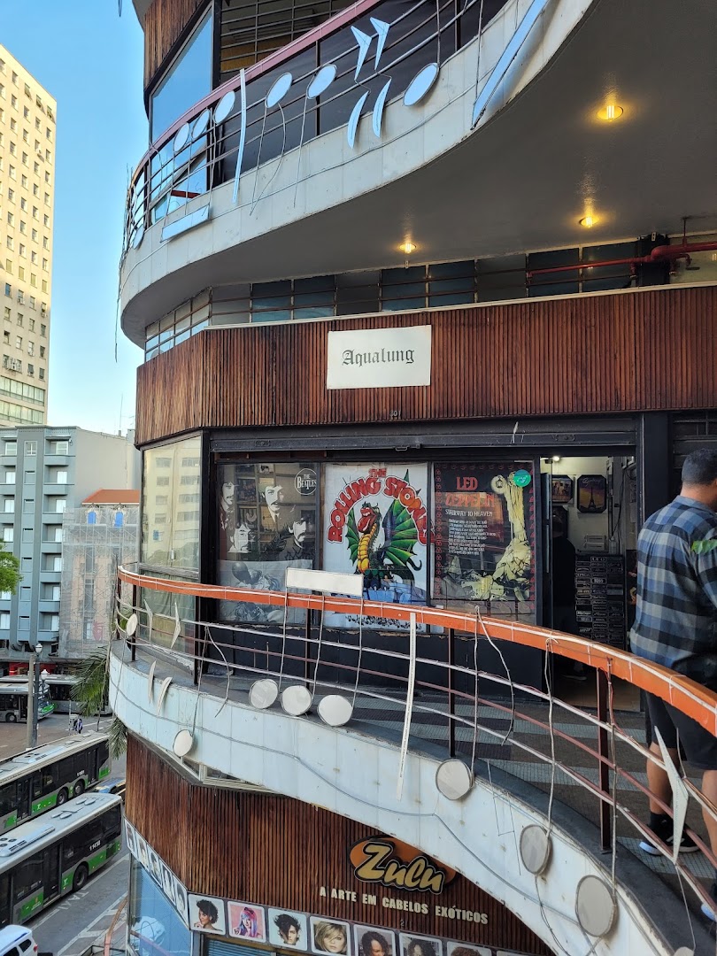 The exterior of Aqualung Records, a shop with music-themed decor and band posters.