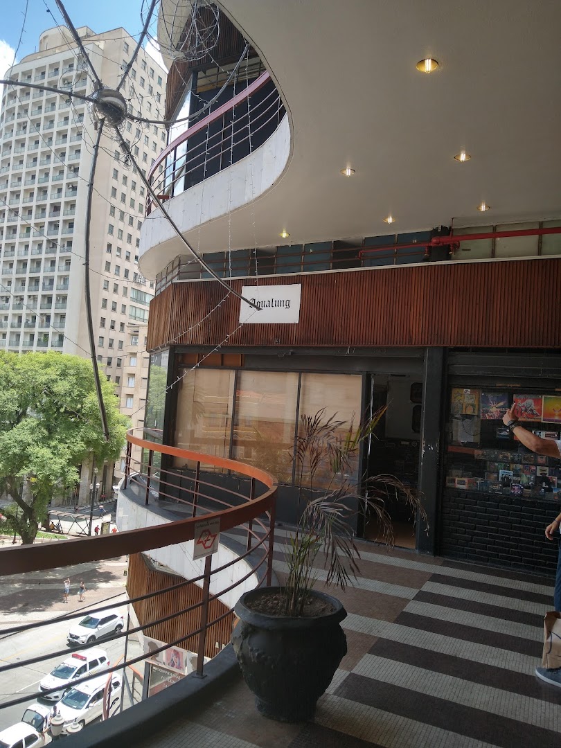 The exterior of Aqualung Records, a shop with a distinctive curved balcony and signage.