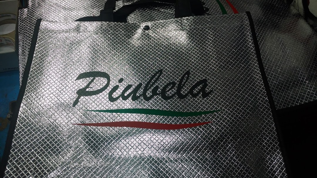 A close-up of a silver reusable shopping bag with the 'Diabela' logo and red and green stripes.