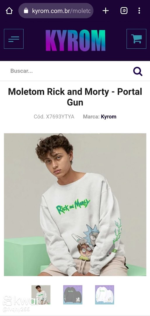A young man models a white sweatshirt with a Rick and Morty graphic.