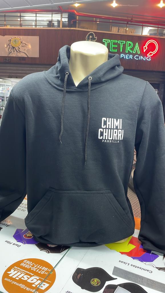 A black hoodie with 'CHIMI CHURRI PARRILLA' printed on the chest, displayed on a mannequin.