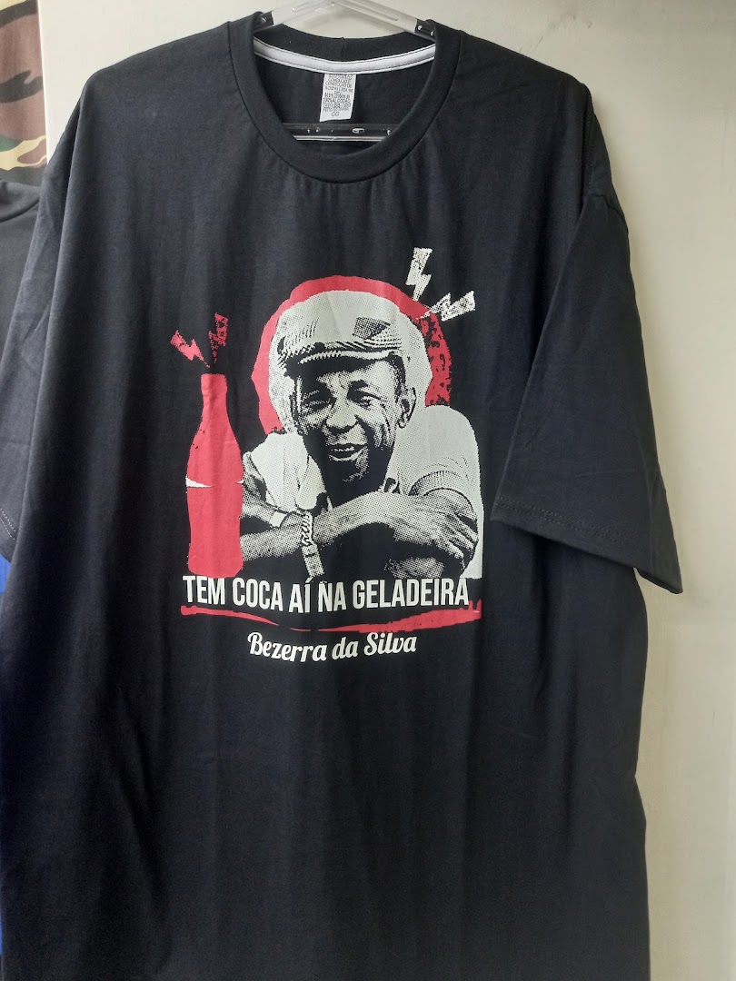 A black t-shirt with a graphic print featuring a man and text.