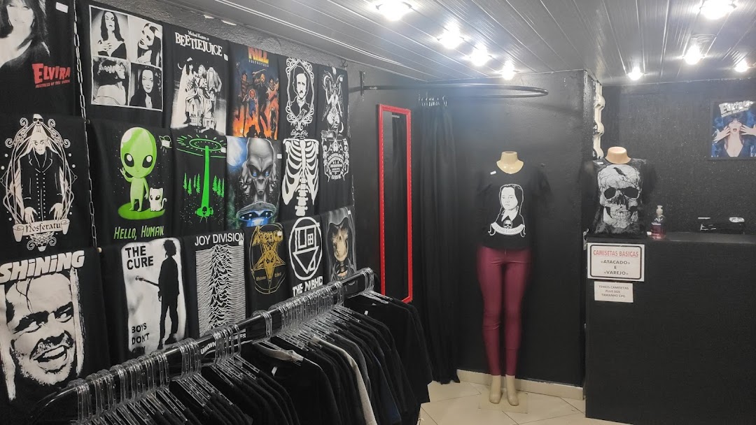 Interior of a shop displaying various graphic t-shirts and mannequins.