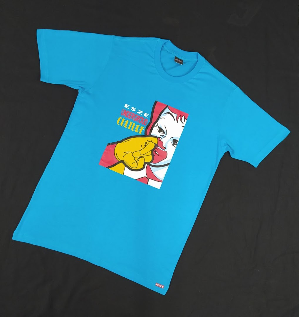 A bright blue t-shirt with a graphic print of a cartoon character and text.