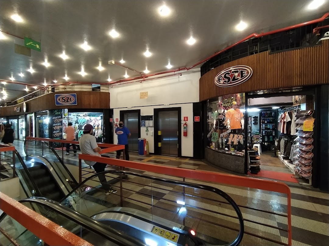 The Esze shop front displays athletic apparel and accessories, with mannequins and clothing racks visible.