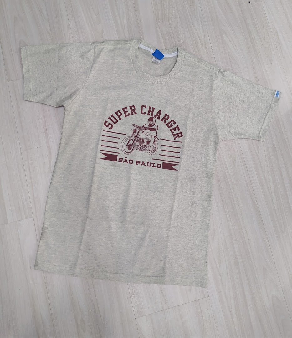 A light grey t-shirt with a graphic print of a motorcycle and text.