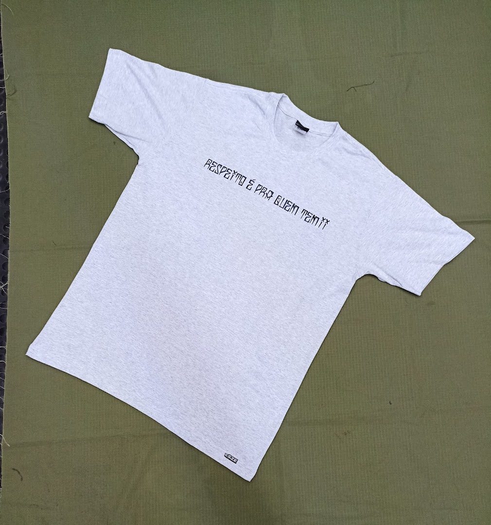 A light grey t-shirt with black text printed on the front, laid flat.