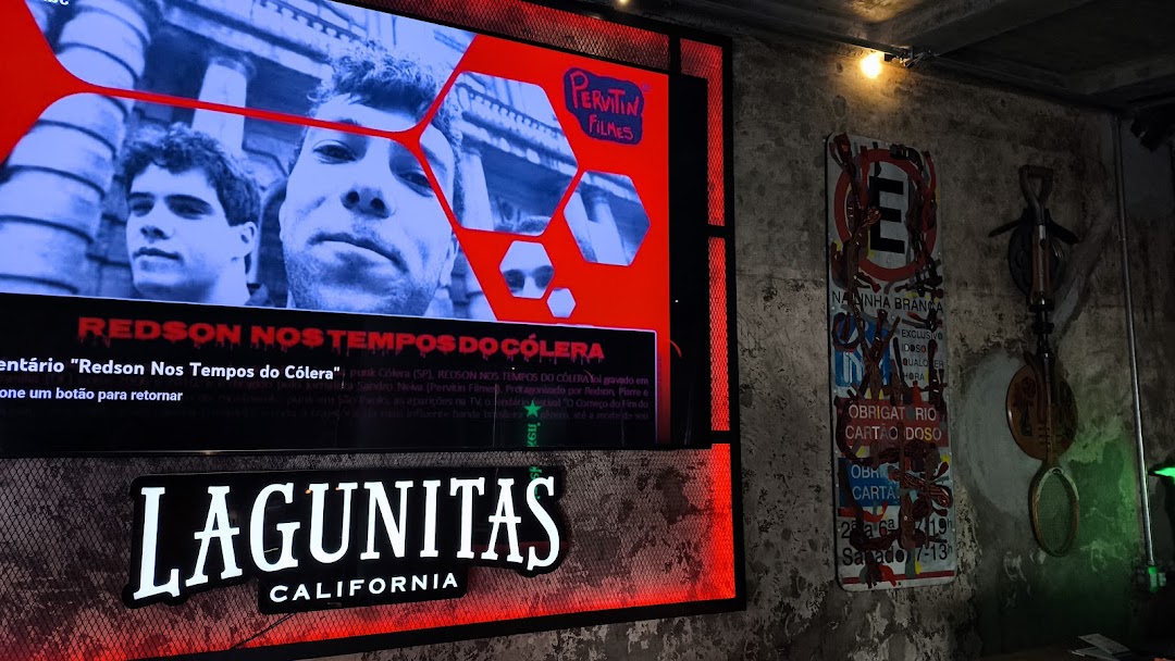 A screen displays a film title and images, with a Lagunitas logo below.