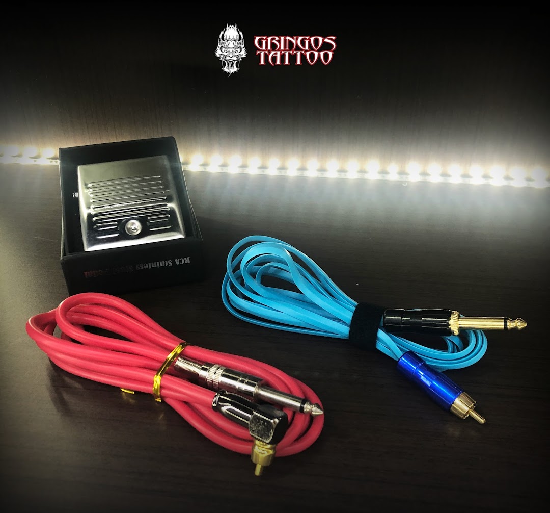 Gringos Tattoo shop logo with tattoo machine power supply and clip cords.
