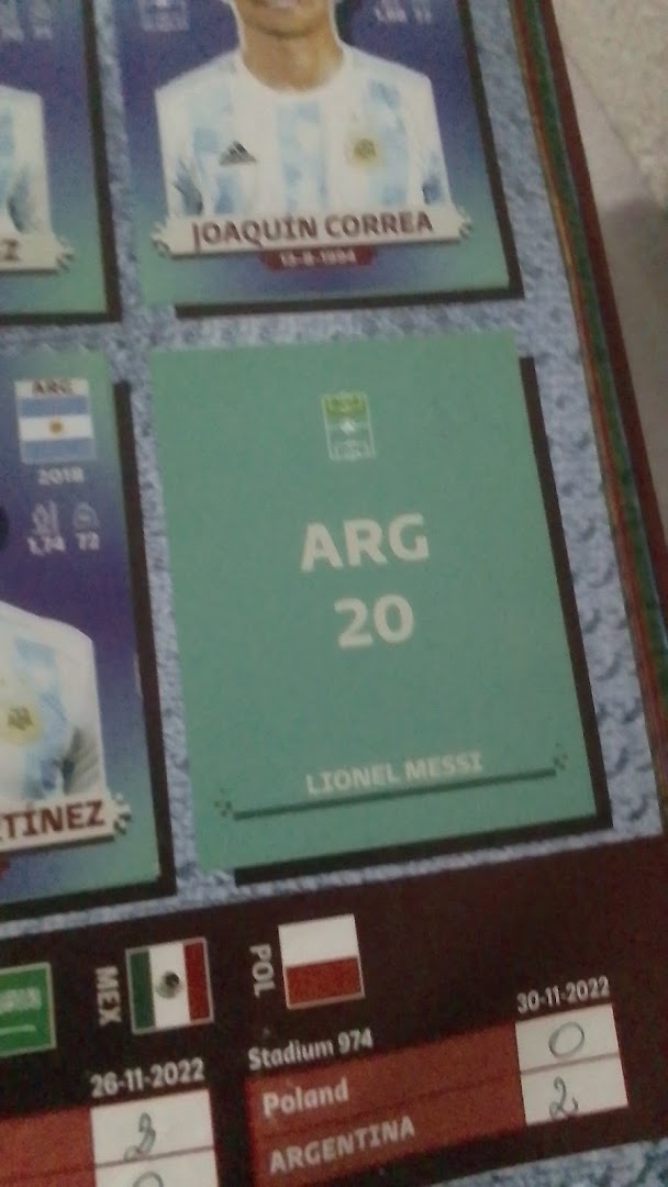 A collection of football player stickers, including Lionel Messi and Joaquin Correa.