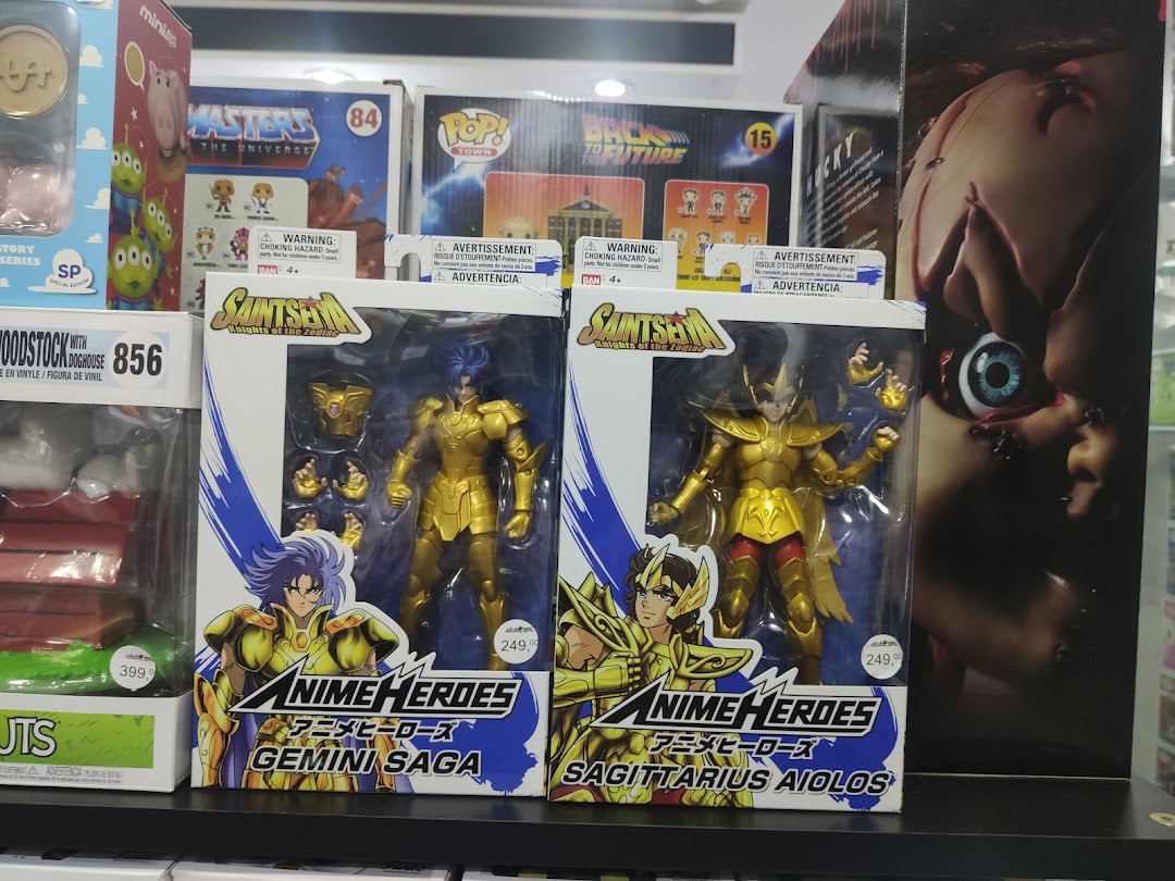 Display of collectible action figures, including Saint Seiya and Masters of the Universe characters.
