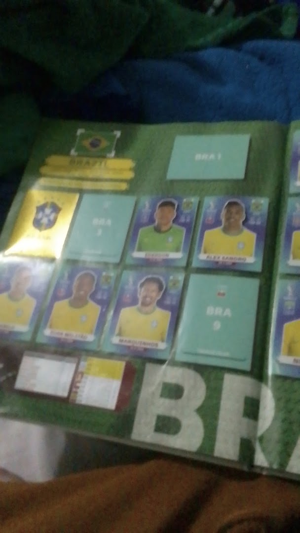 A collection of football stickers, featuring Brazilian players and team crests.