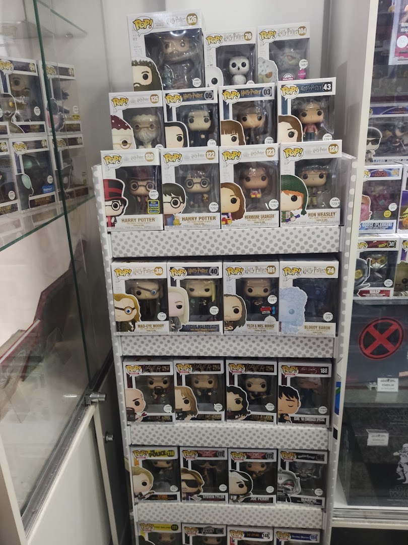 A display shelf filled with various Funko Pop! vinyl figures, primarily from the Harry Potter series.