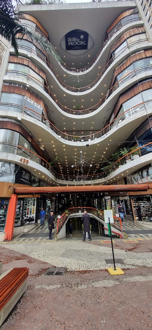 Exterior view of a multi-level shopping arcade with shops visible on lower floors.