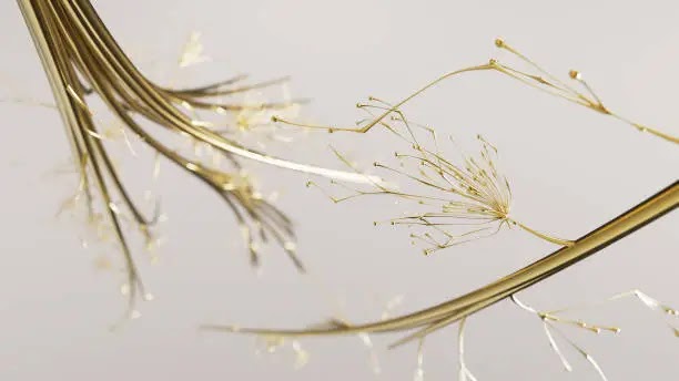 Close-up of delicate golden branches with small buds against a light background.