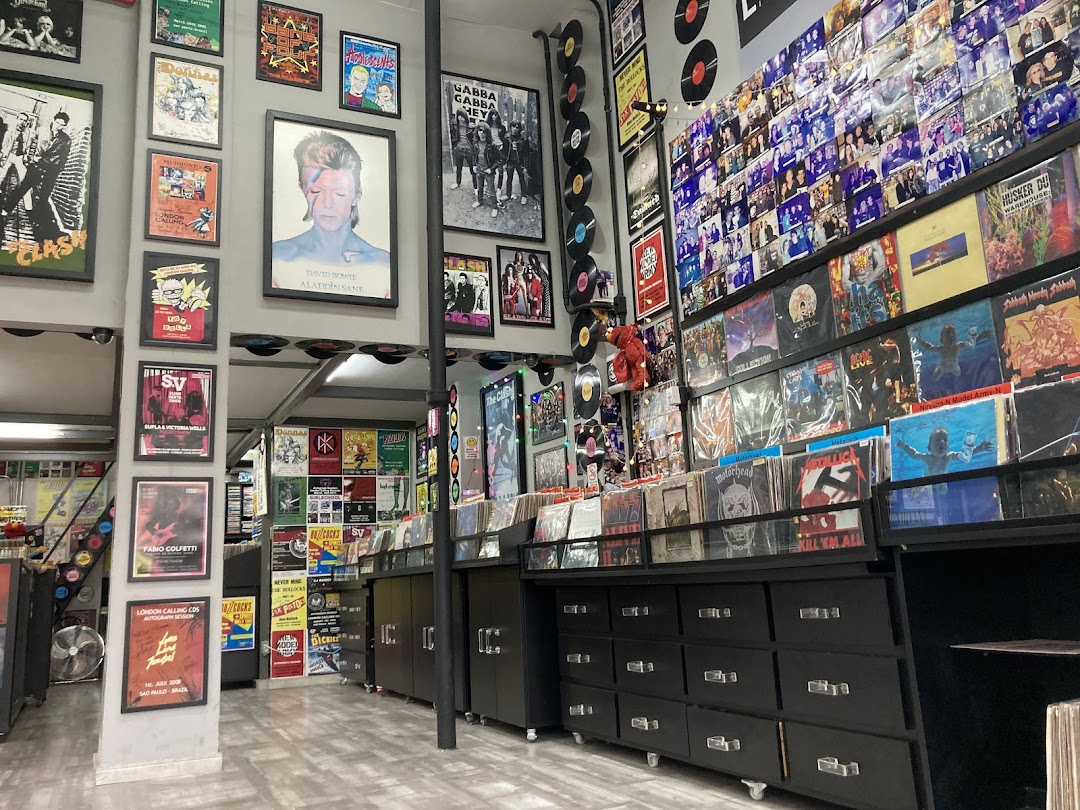 Interior of a record store filled with vinyl records, posters, and memorabilia.
