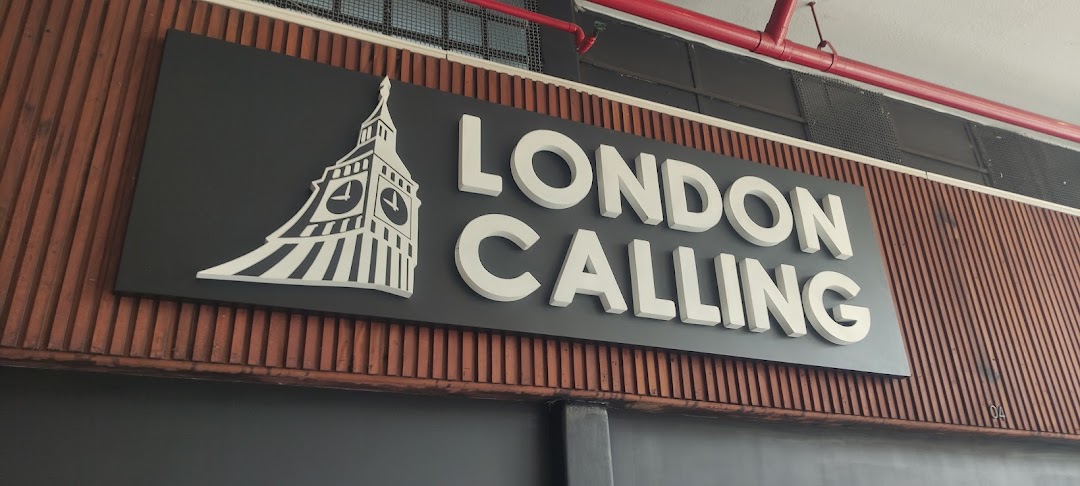 A sign for 'London Calling Discos' featuring a stylized Big Ben.