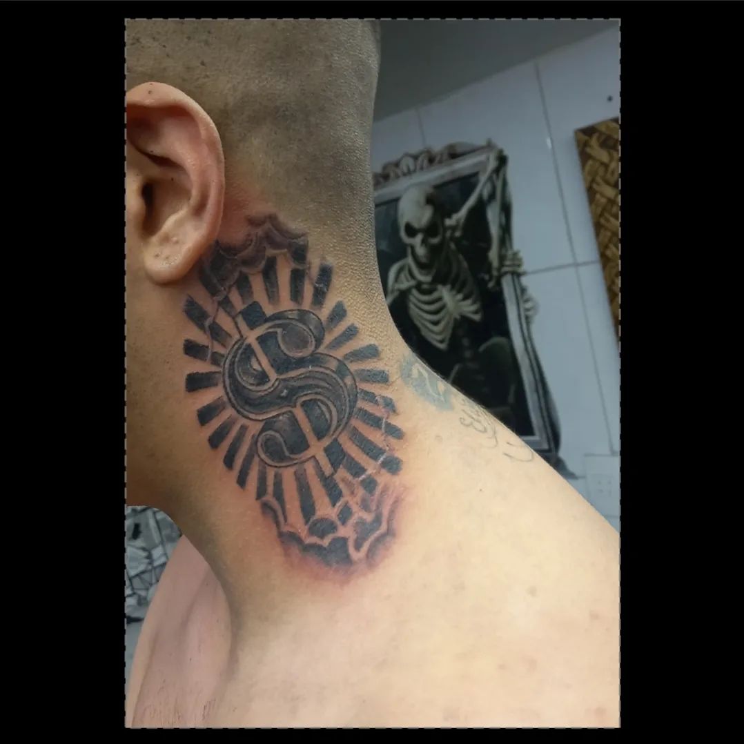A close-up of a neck tattoo featuring a dollar sign with radiating lines and cloud-like shading.