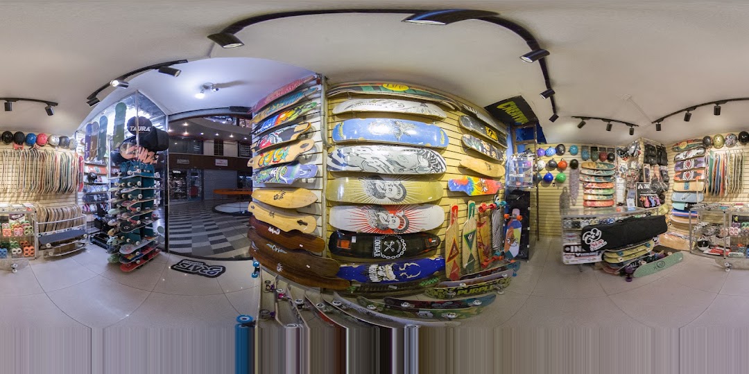Interior view of a skate shop showcasing a wide variety of skateboards and accessories.