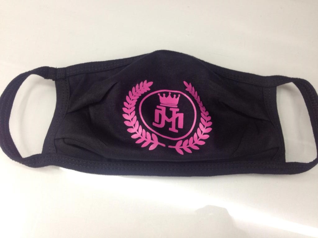 A black face mask with a pink logo featuring a crown and laurel wreath.