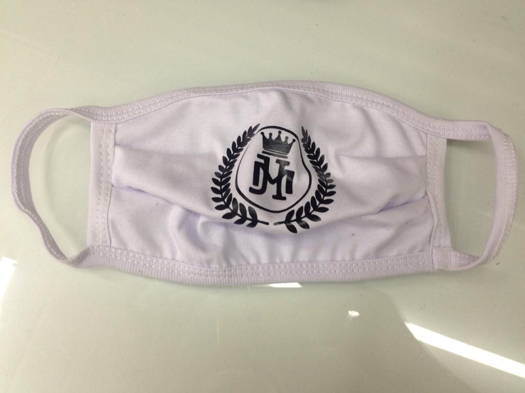 A white face mask with a black logo featuring a crown and laurel wreath.