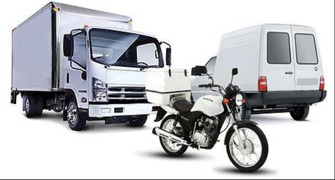A white delivery truck, motorcycle with a cooler, and a white van.