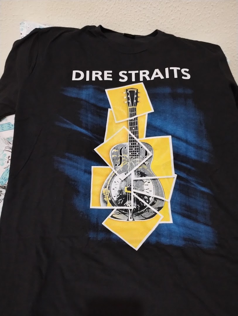 A black t-shirt with the band name 'Dire Straits' and a graphic of a guitar.