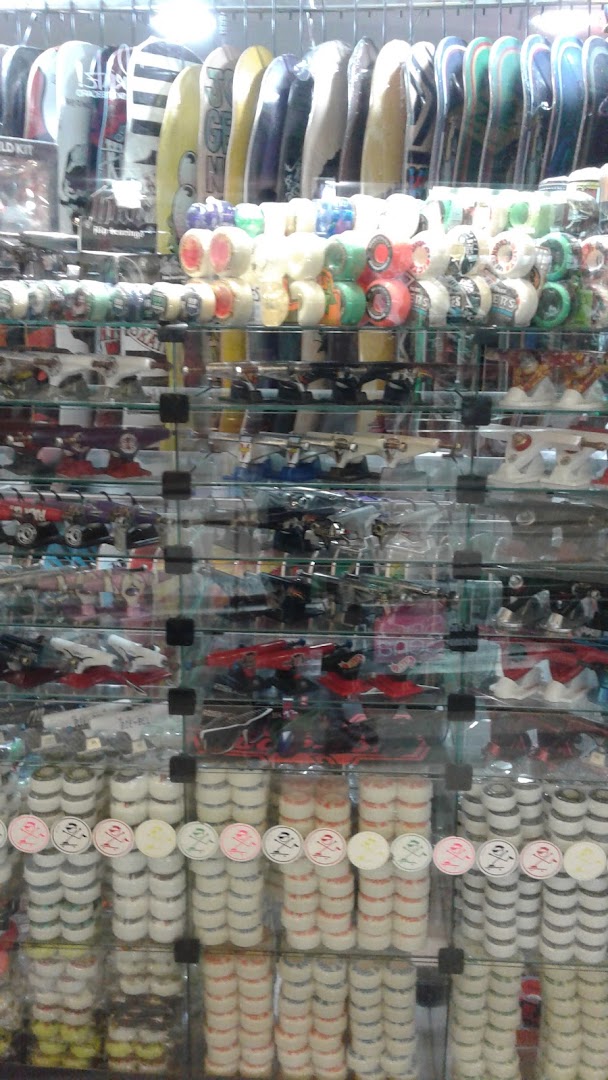 A display of skateboards, wheels, and other skateboarding accessories in a retail store.