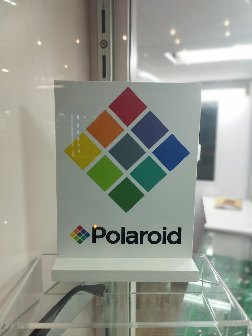 A sign with the Polaroid logo and colorful squares is displayed.