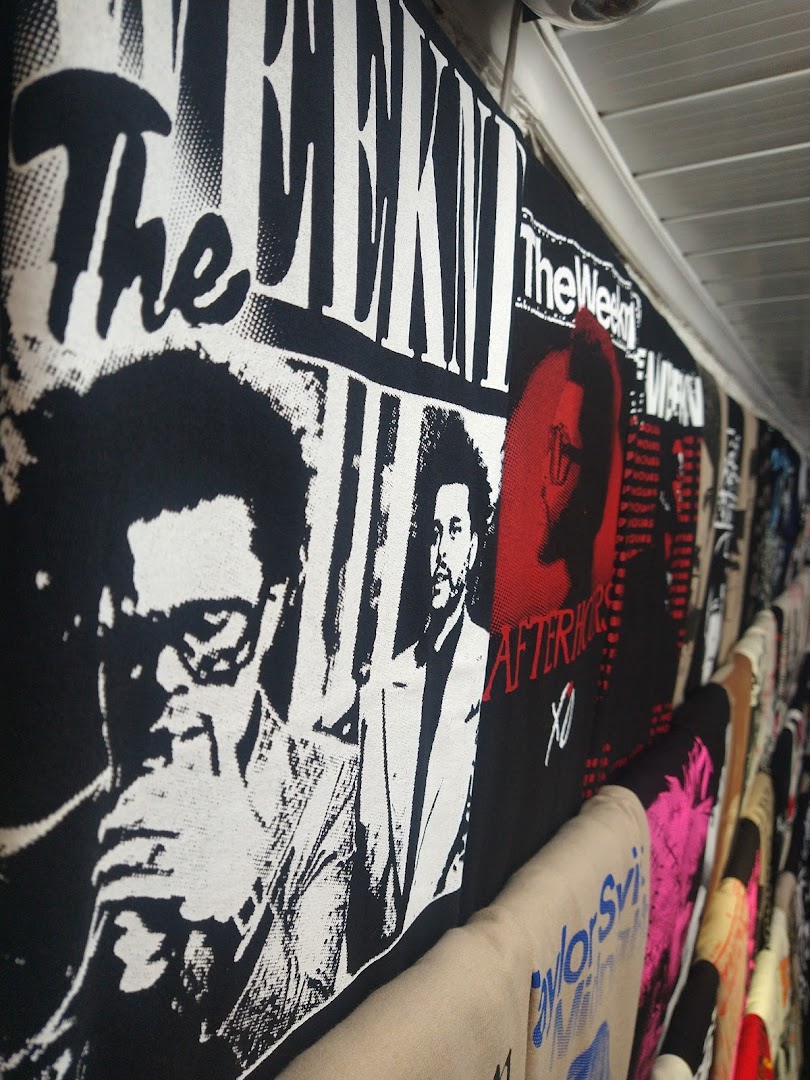 A display of merchandise featuring The Weeknd's album art and imagery.