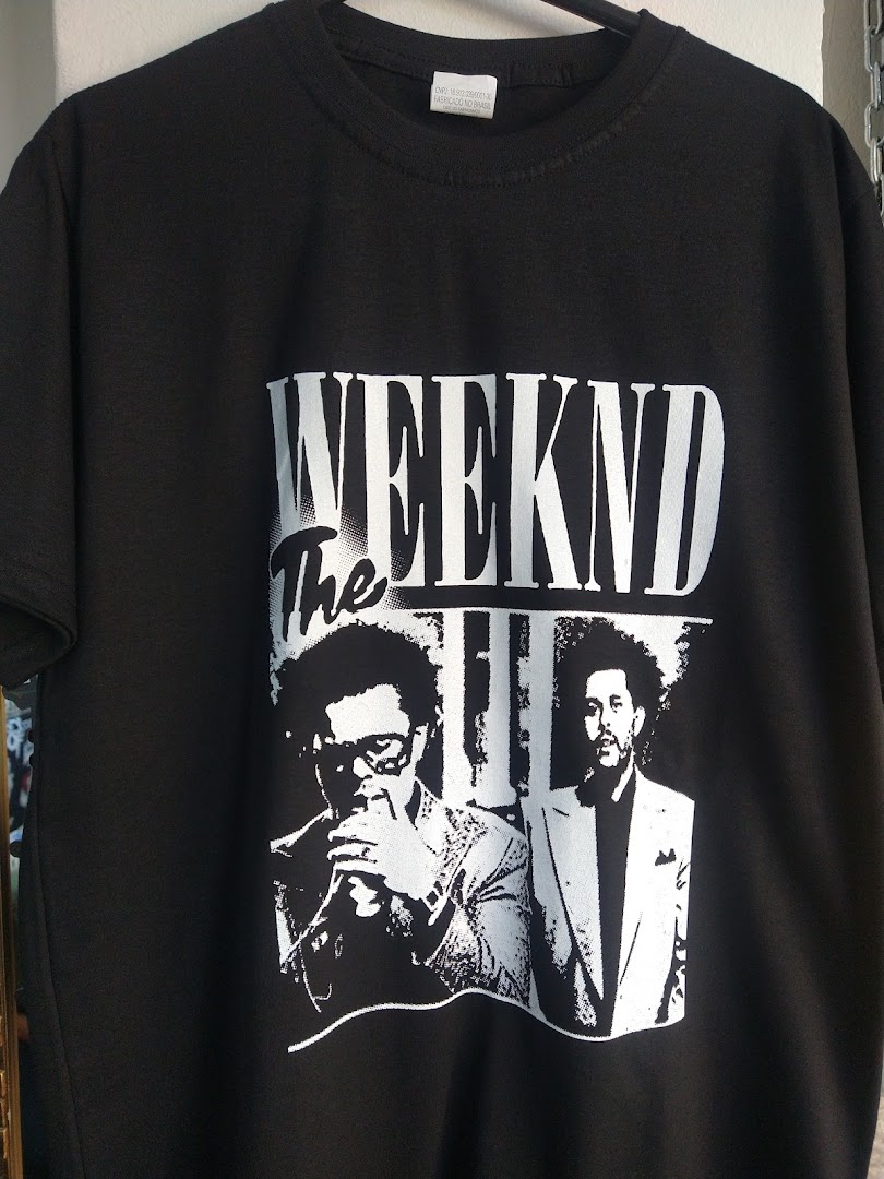 A black t-shirt featuring a graphic print of The Weeknd.