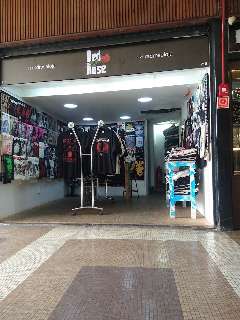 The Red Rose Store features a wide selection of graphic t-shirts displayed on racks and walls.
