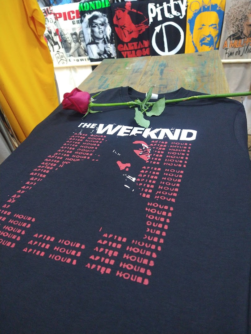 A black t-shirt with 'The Weeknd' logo and 'After Hours' text, with a red rose on it.