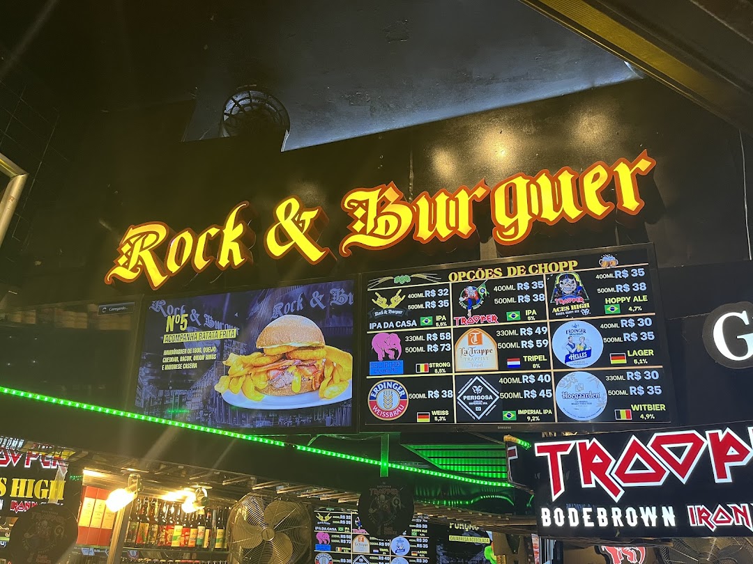 A neon sign for Rock & Burguer with a menu board displaying beer options and a burger.