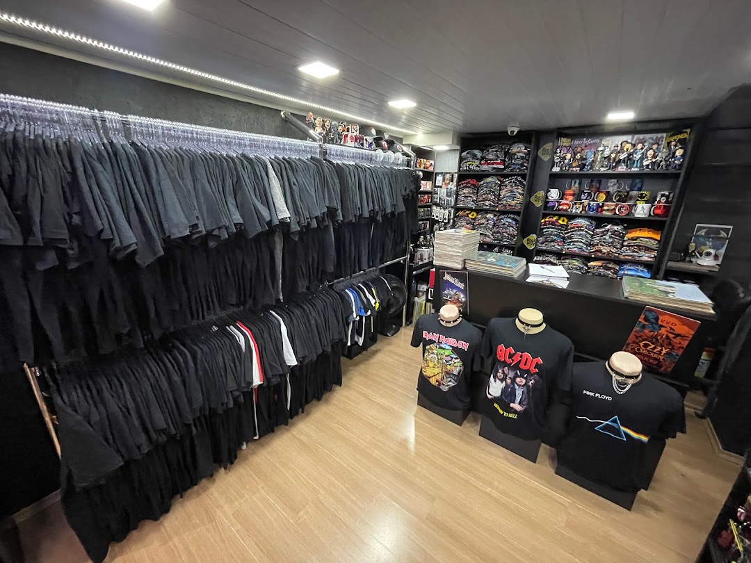 Interior of a store displaying a wide selection of band t-shirts and merchandise.