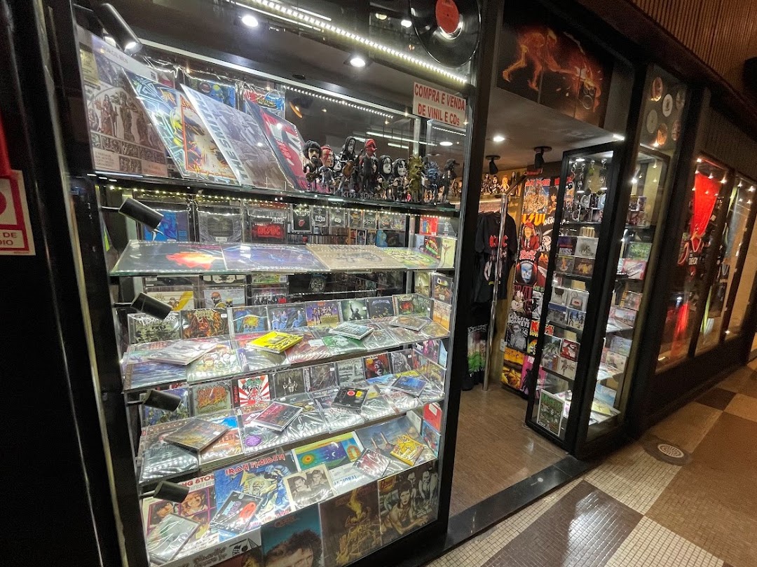 A display case filled with CDs and merchandise, with a shop entrance visible.