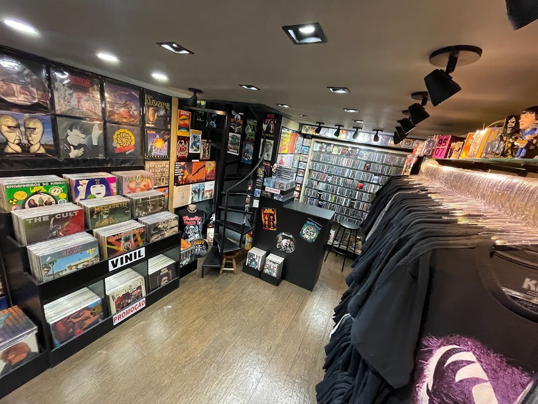Interior of a record and t-shirt store, showcasing vinyl records and band merchandise.