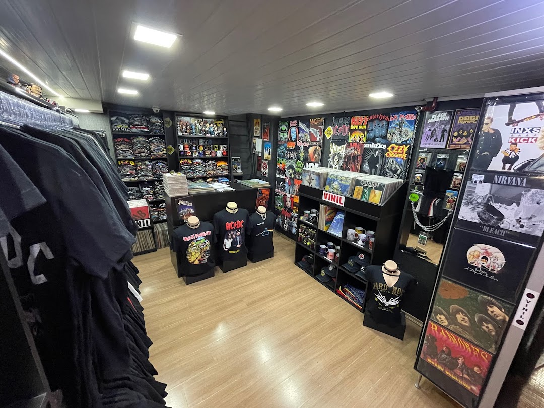 Interior of a rock-themed store selling band t-shirts, vinyl records, and memorabilia.