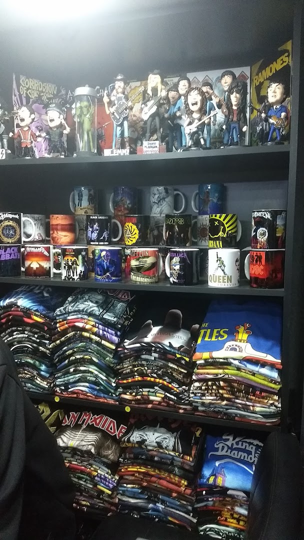 Shelves filled with band merchandise including t-shirts, mugs, and collectible figures.