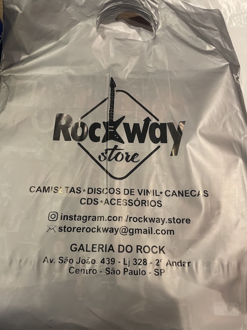 A silver shopping bag with the Rockway Store logo and contact information printed on it.