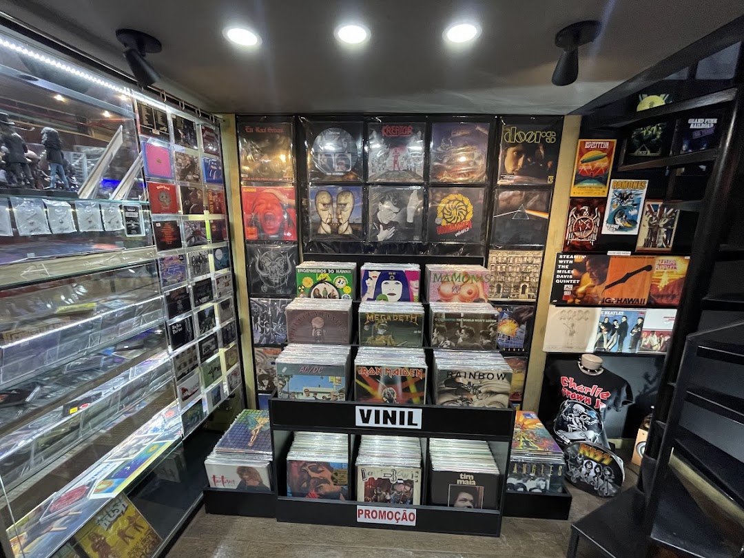 Interior of a record store displaying vinyl records and band t-shirts.