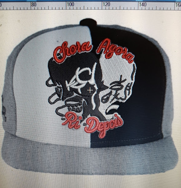 A close-up of a two-toned baseball cap with embroidered text and graphics.