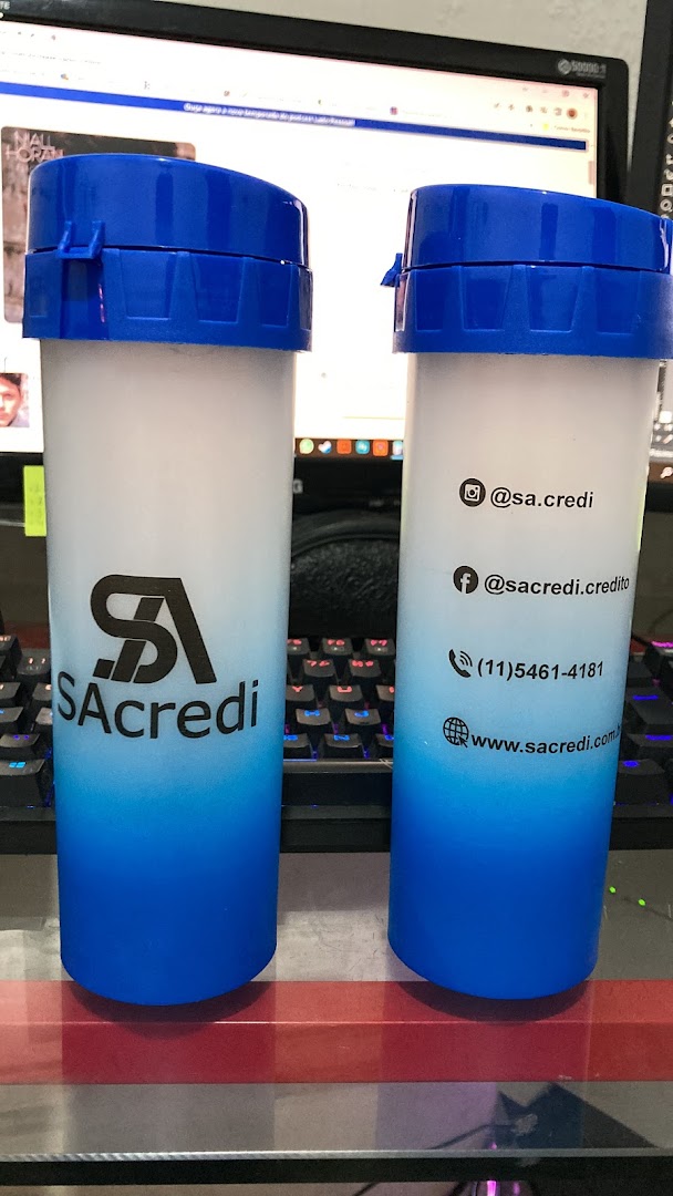 Two personalized cups with blue lids and blue gradient bases, featuring company branding and contact information.