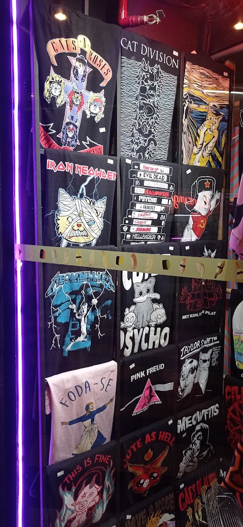 A display of t-shirts featuring various pop culture and cat-themed designs.