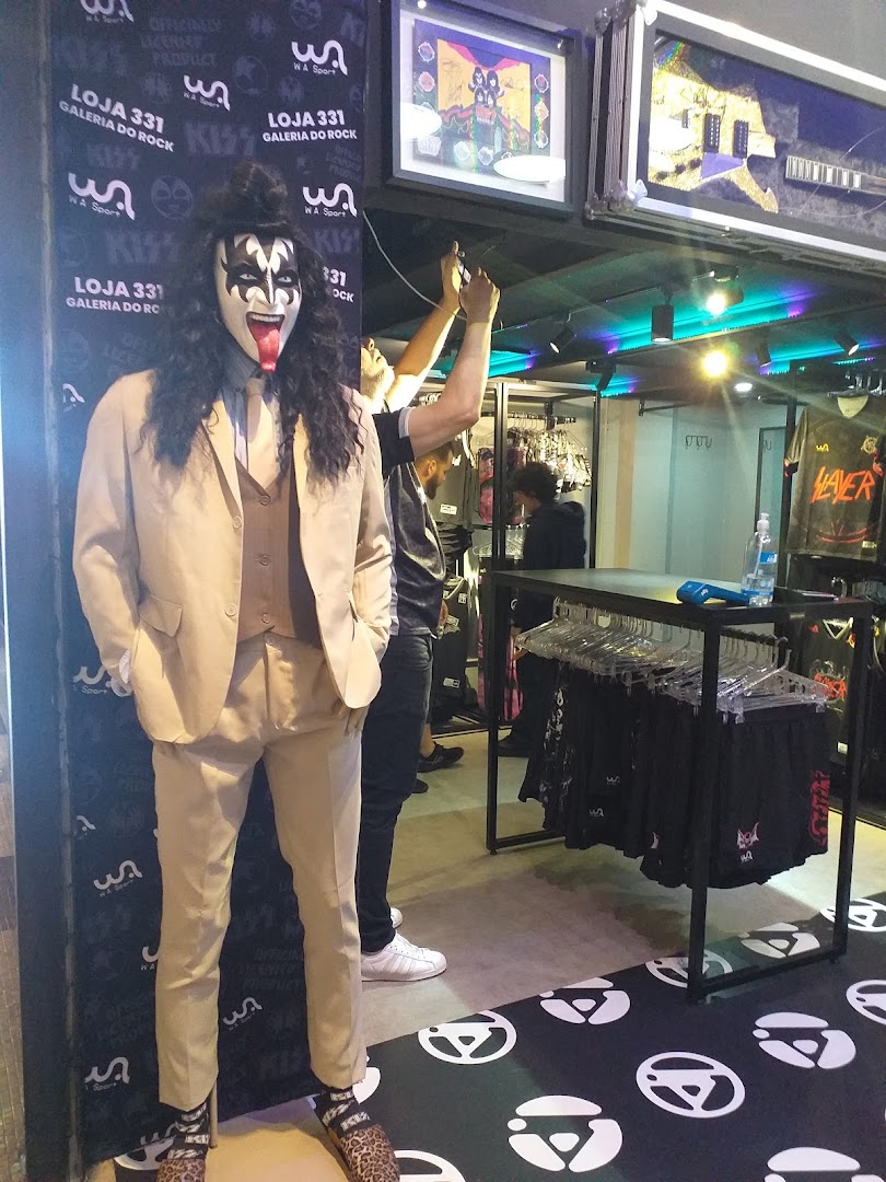 A mannequin dressed as Gene Simmons from KISS stands in a rock-themed store.
